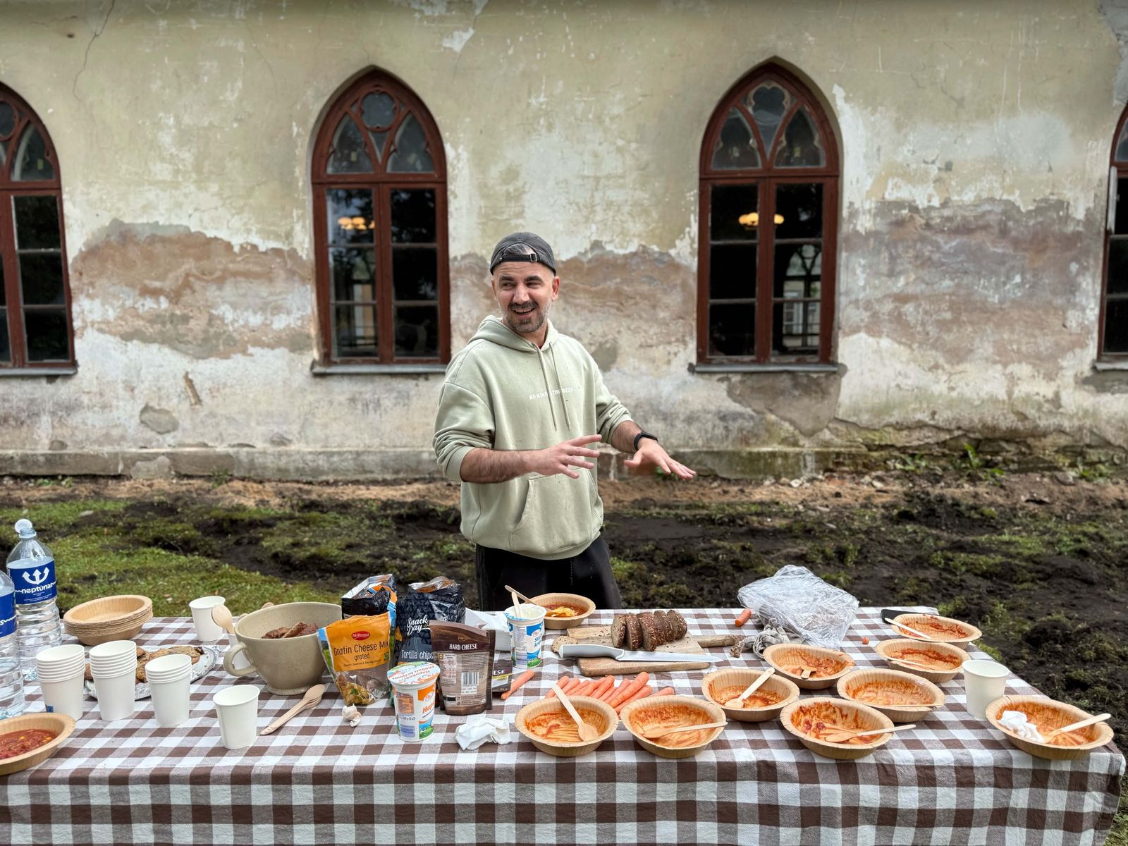 Raimonds serving lunch at a work day